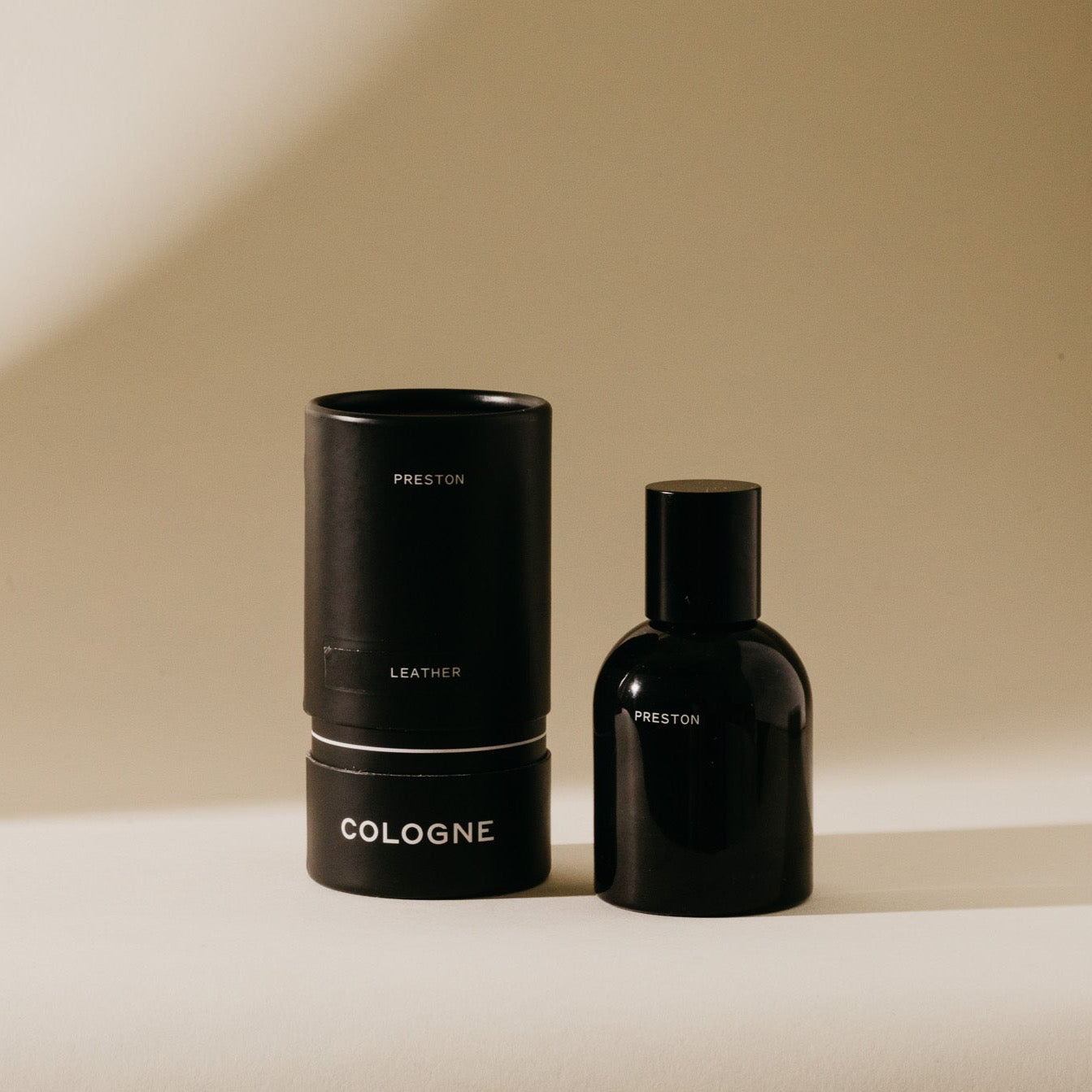 Cologne 1.7 oz set: black bottle and tube with Leather label