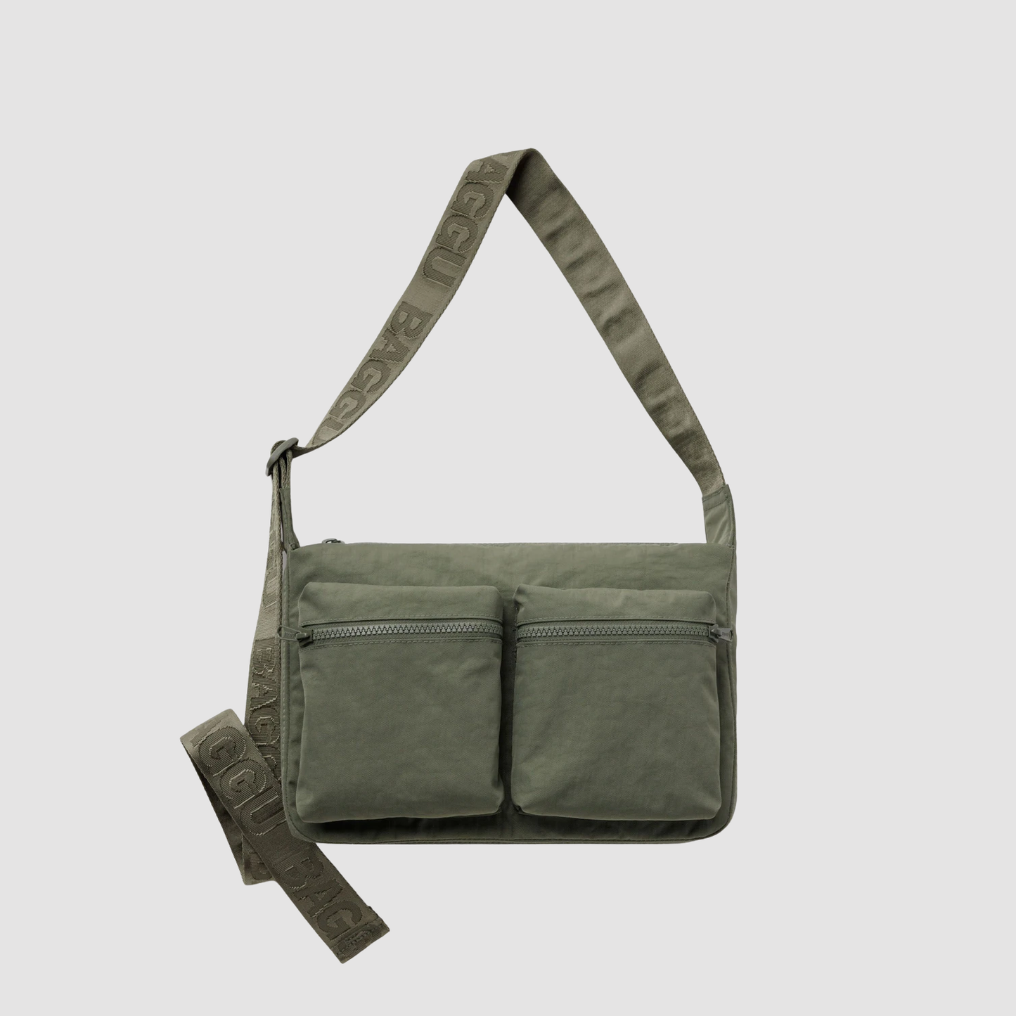 Olive green medium cargo crossbody bag with two front zip pockets and adjustable strap.