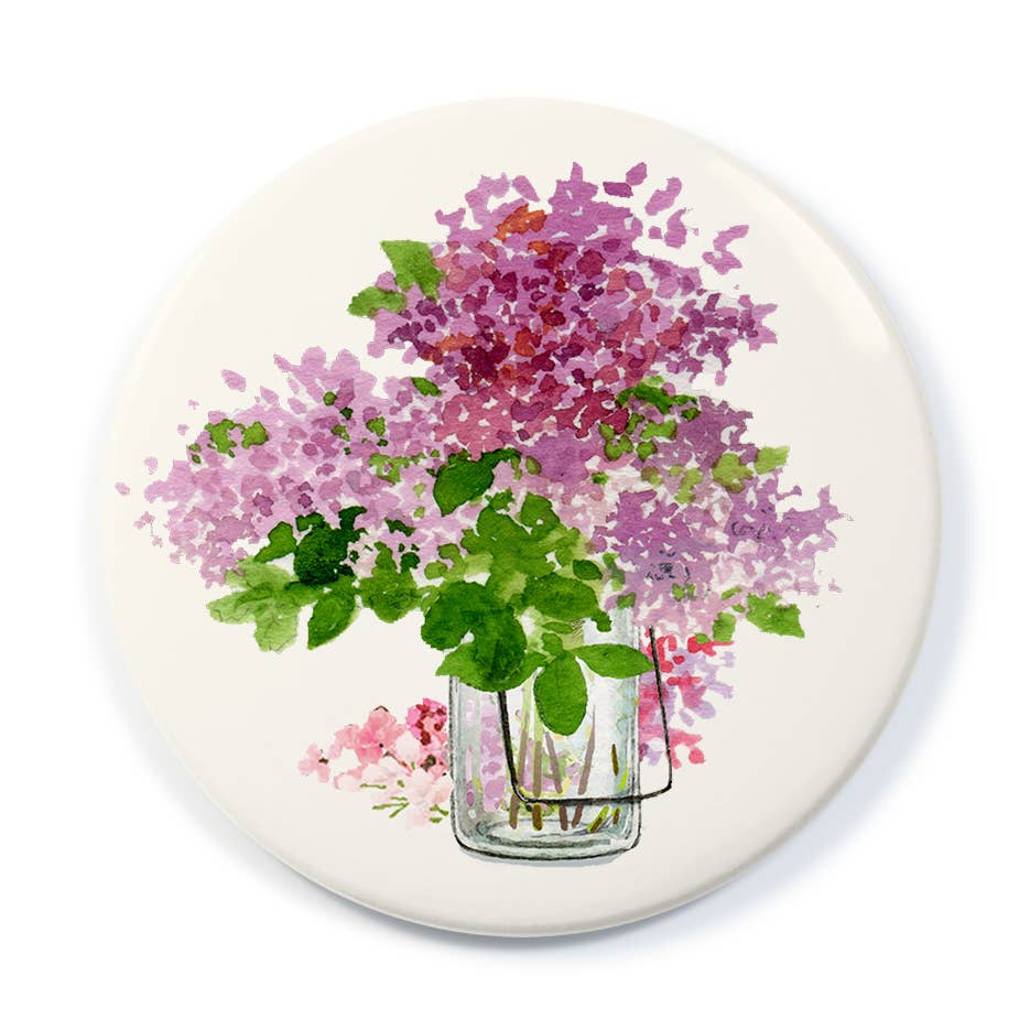 Pocket mirror with circular floral print, lilacs and greenery in a vase