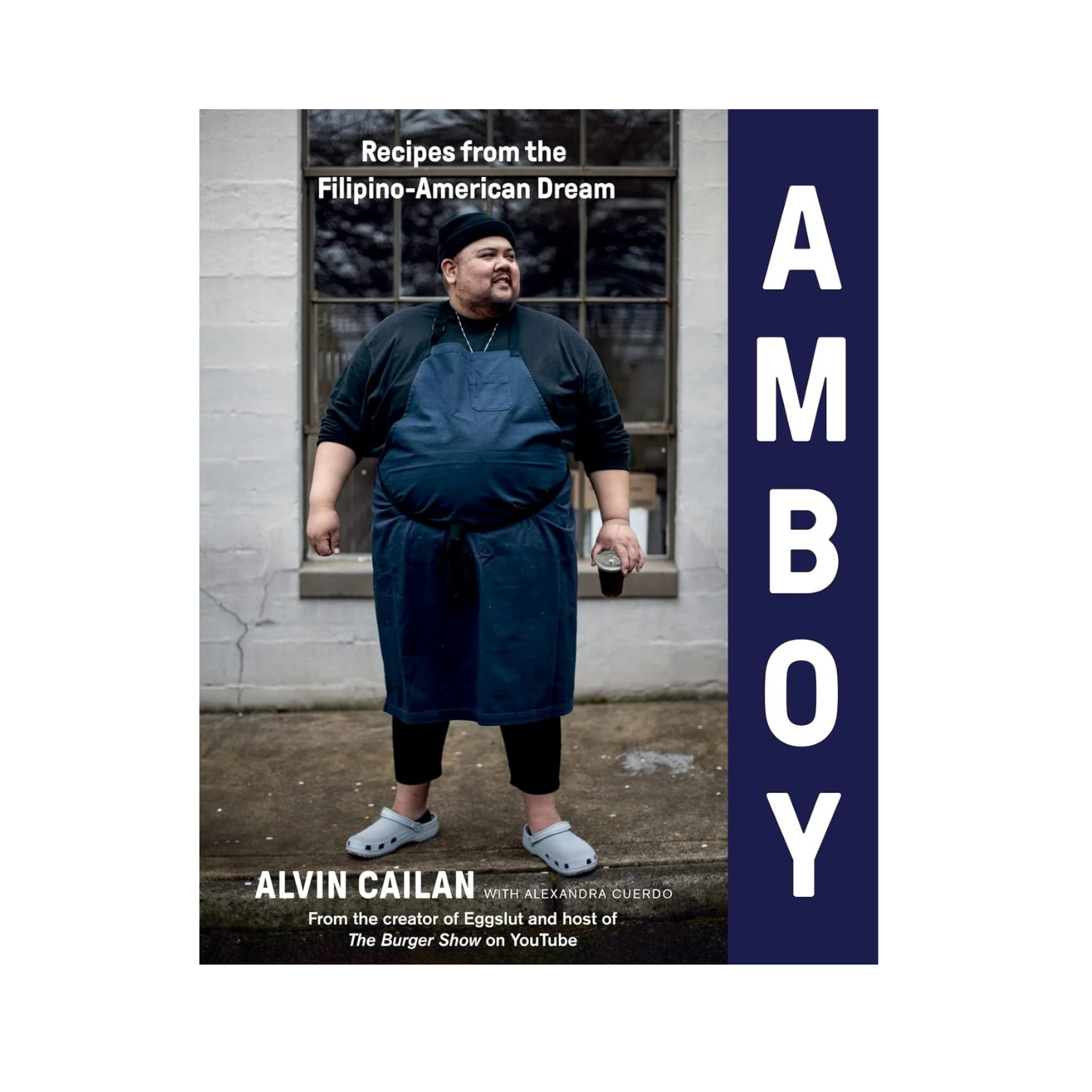 Cookbook front cover with chef in apron and vertical AMBOY lettering