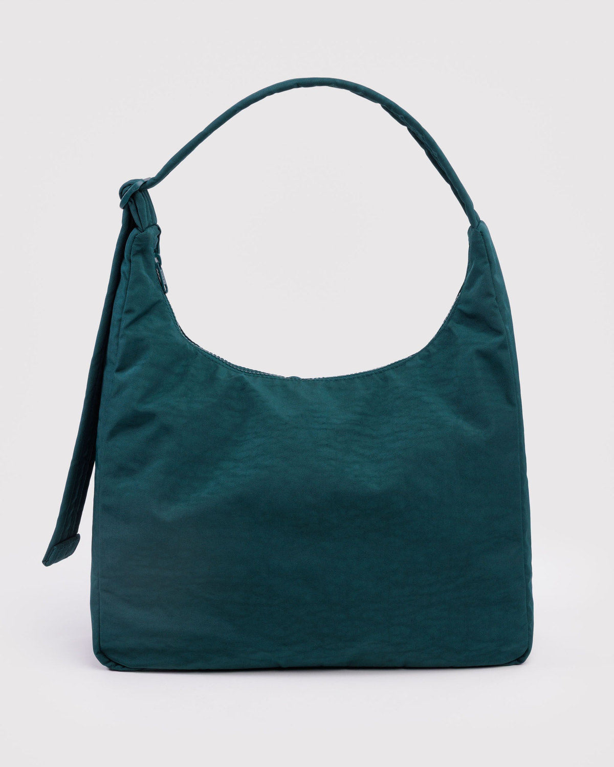 Nylon shoulder bag in deep teal green with short top handle and dangling side tie.