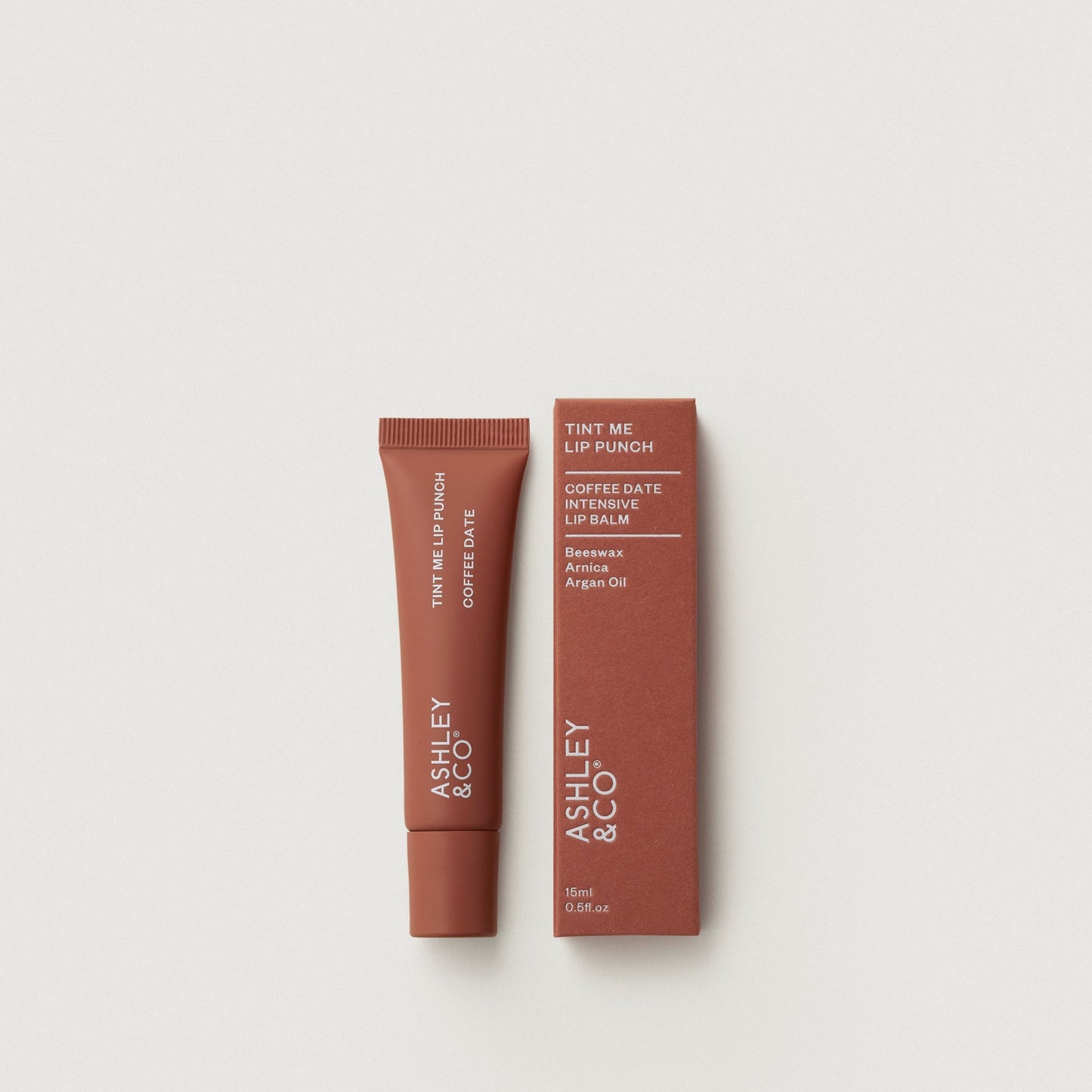 Tint Me Lip Punch lip balm, coffee date brown tube