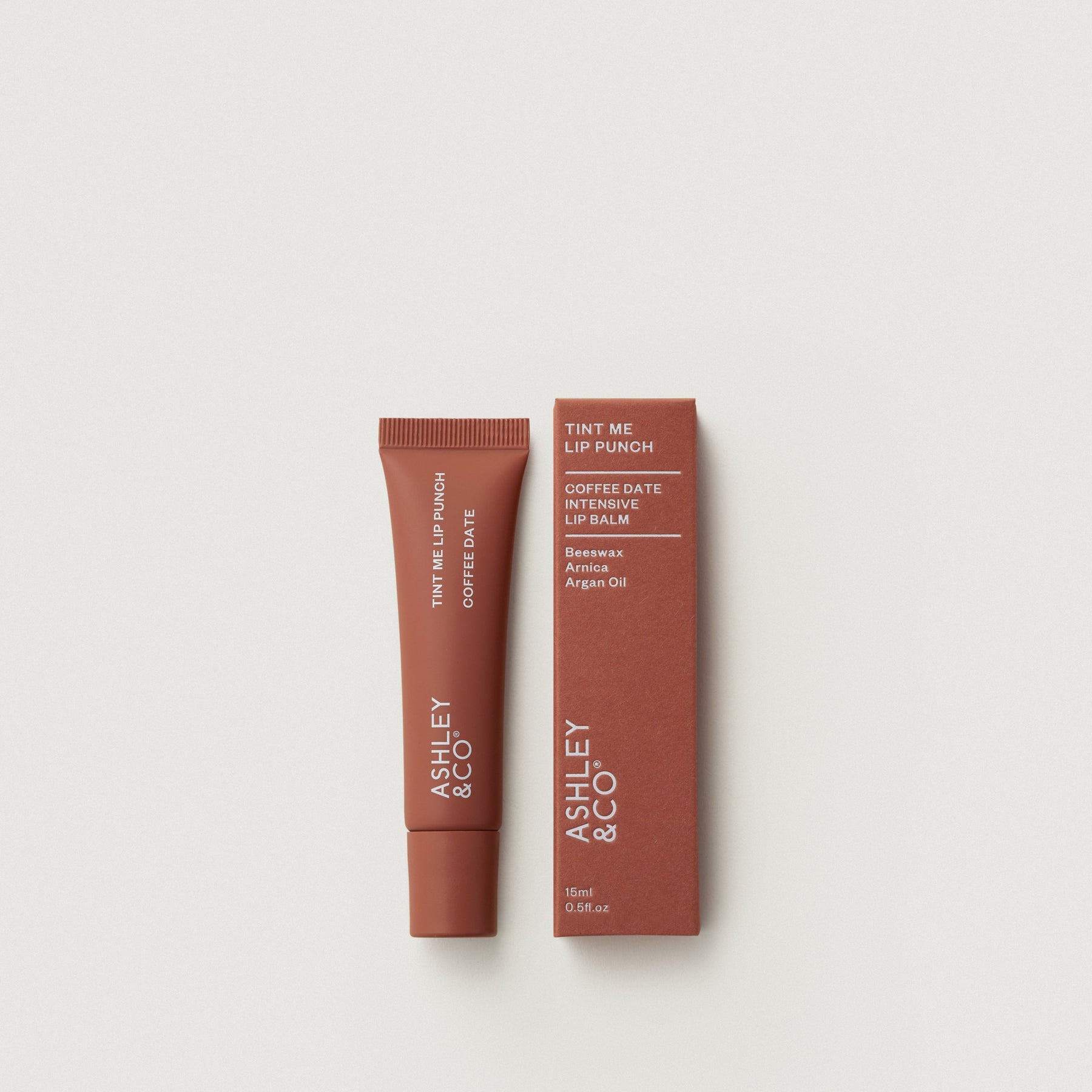 Tint Me Lip Punch lip balm, coffee date brown tube