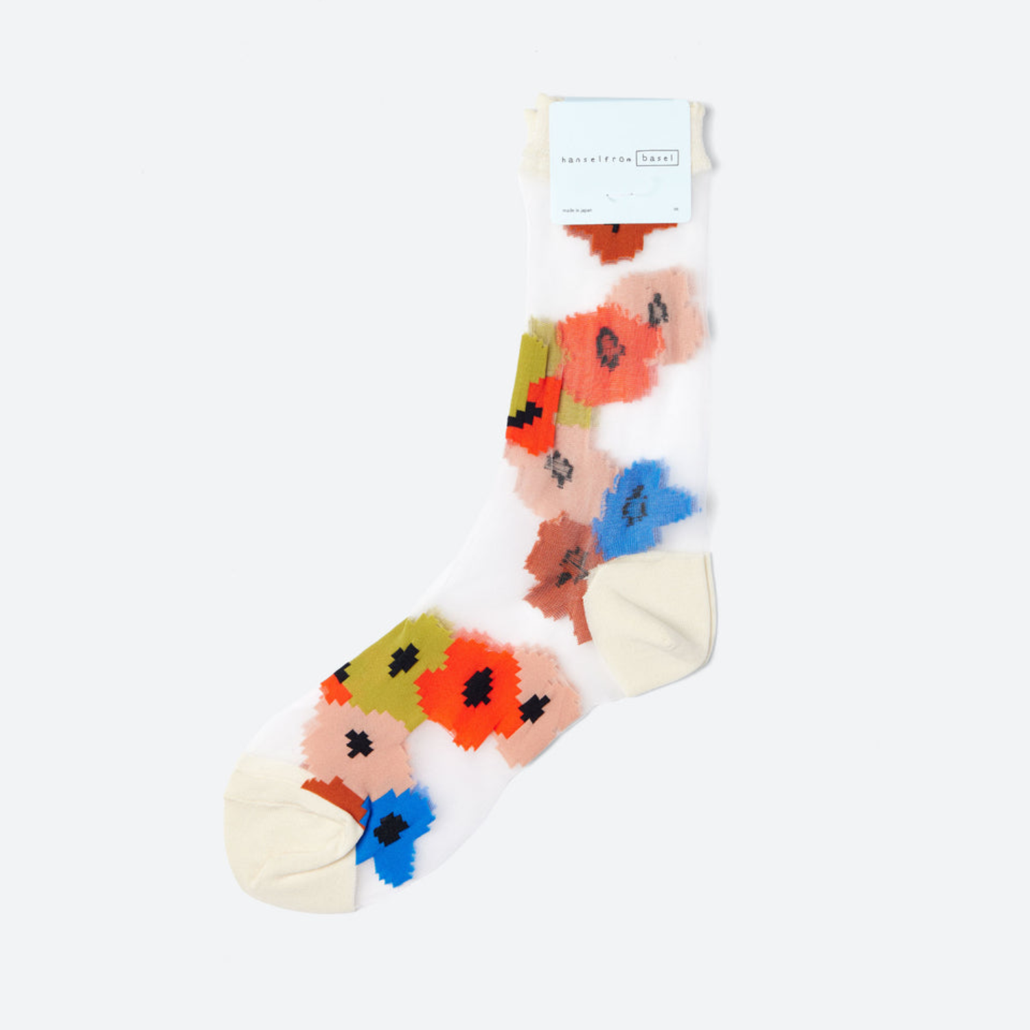 White sheer crew socks with multicolor pixel floral pattern and ribbed cuff