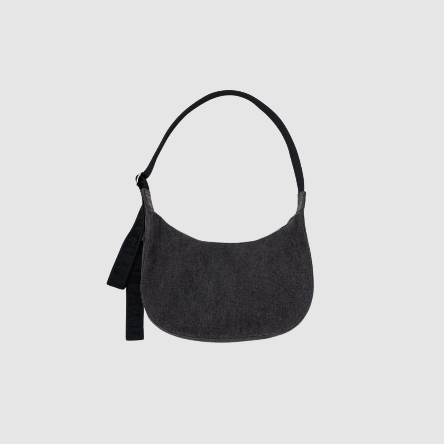 Washed black denim crescent shoulder bag with top handle and short strap