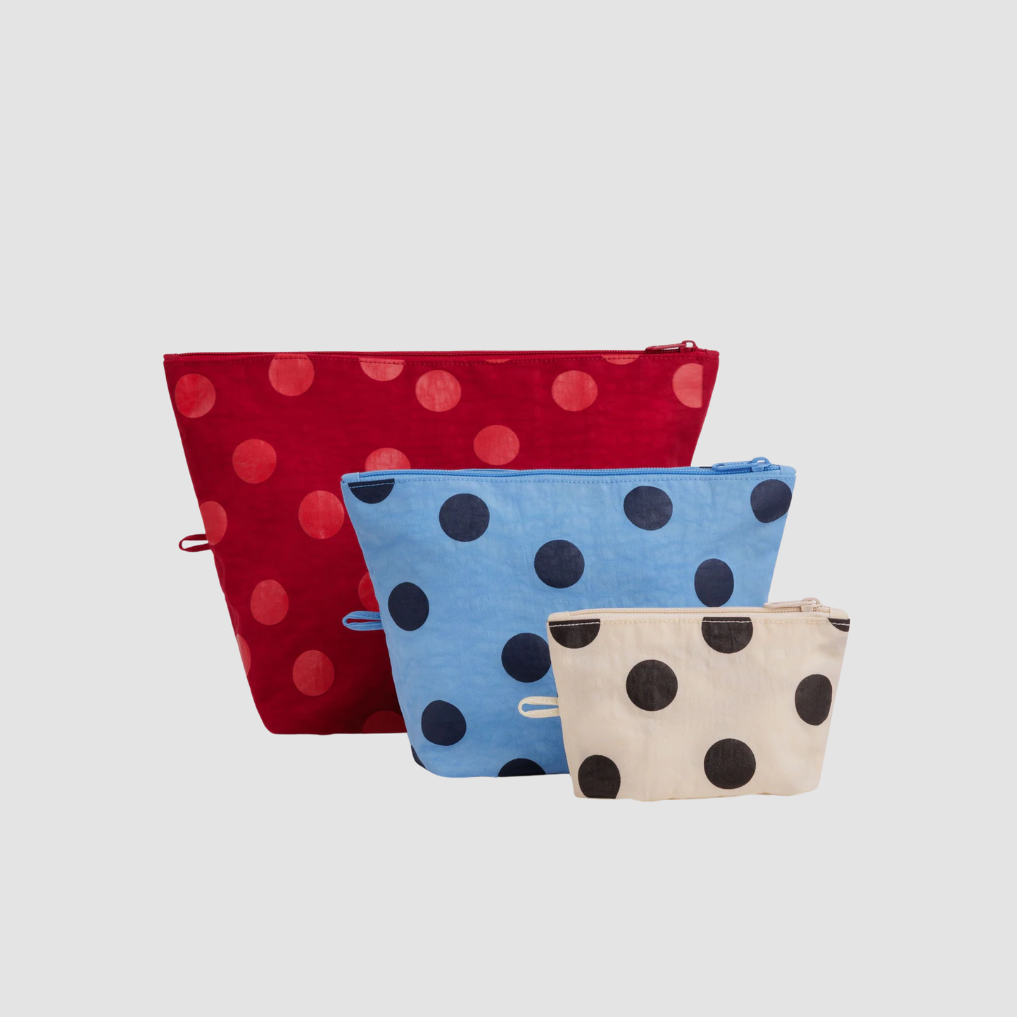 Go pouch set of three fabric zip pouches with red, light blue, and beige dot patterns