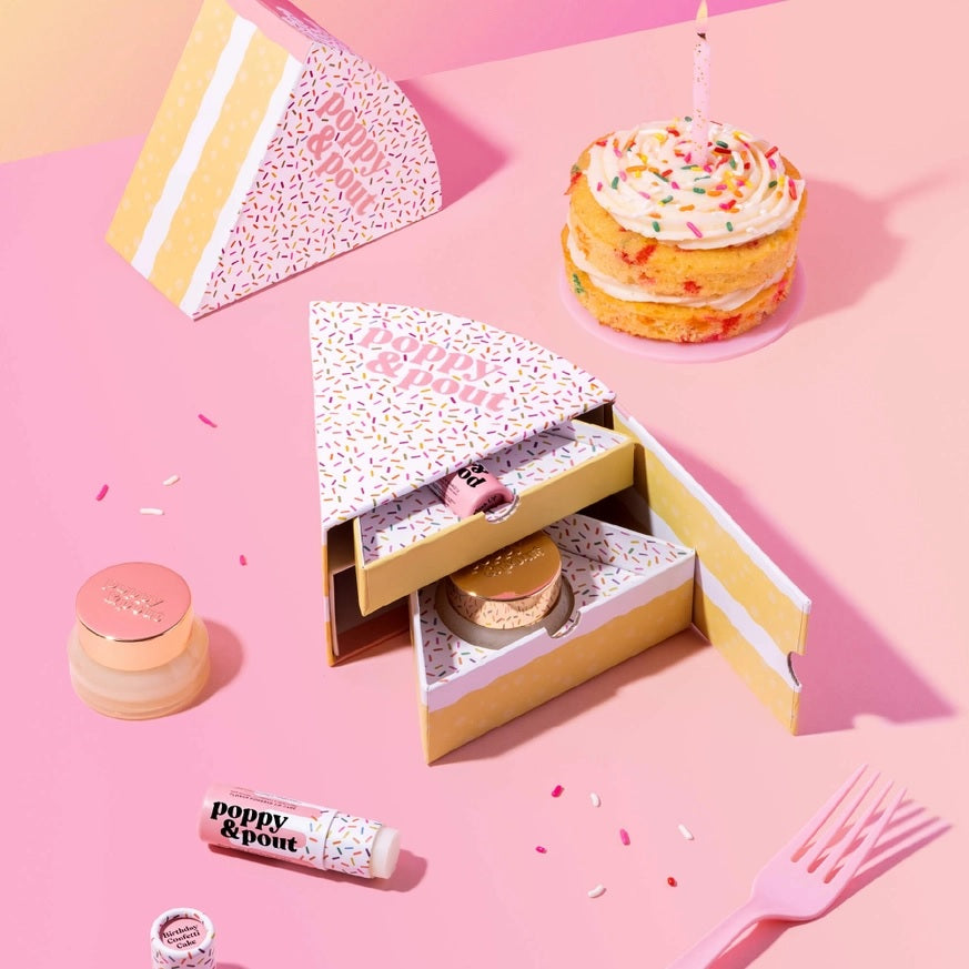 Lip care duo gift set with open box, lip balm tube, white cream jar, and cake
