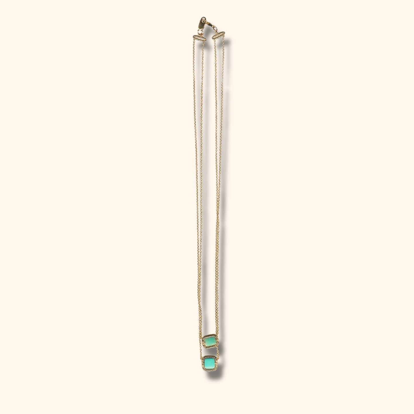 Turquoise square wire-wrapped pendant on 14k gold-filled chain, small size.