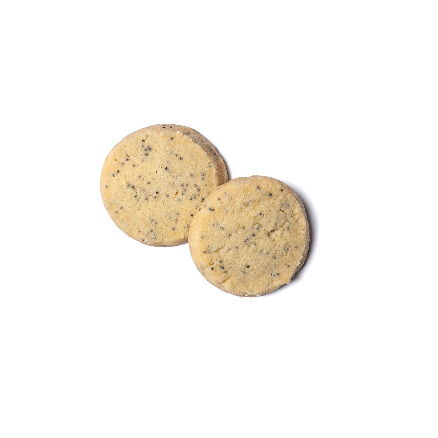 Round lemon poppy shortbread butter cookies, pale yellow with black seeds