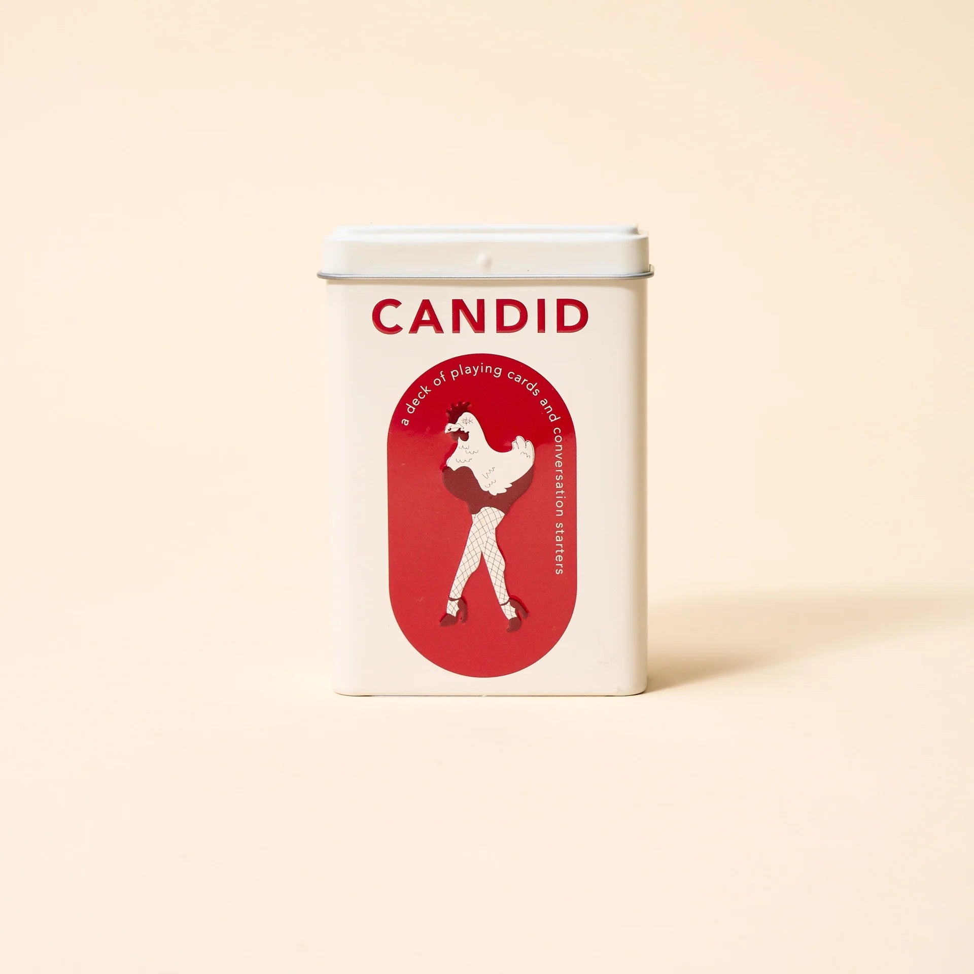 CANDID playing card deck tin with red rooster logo on the front