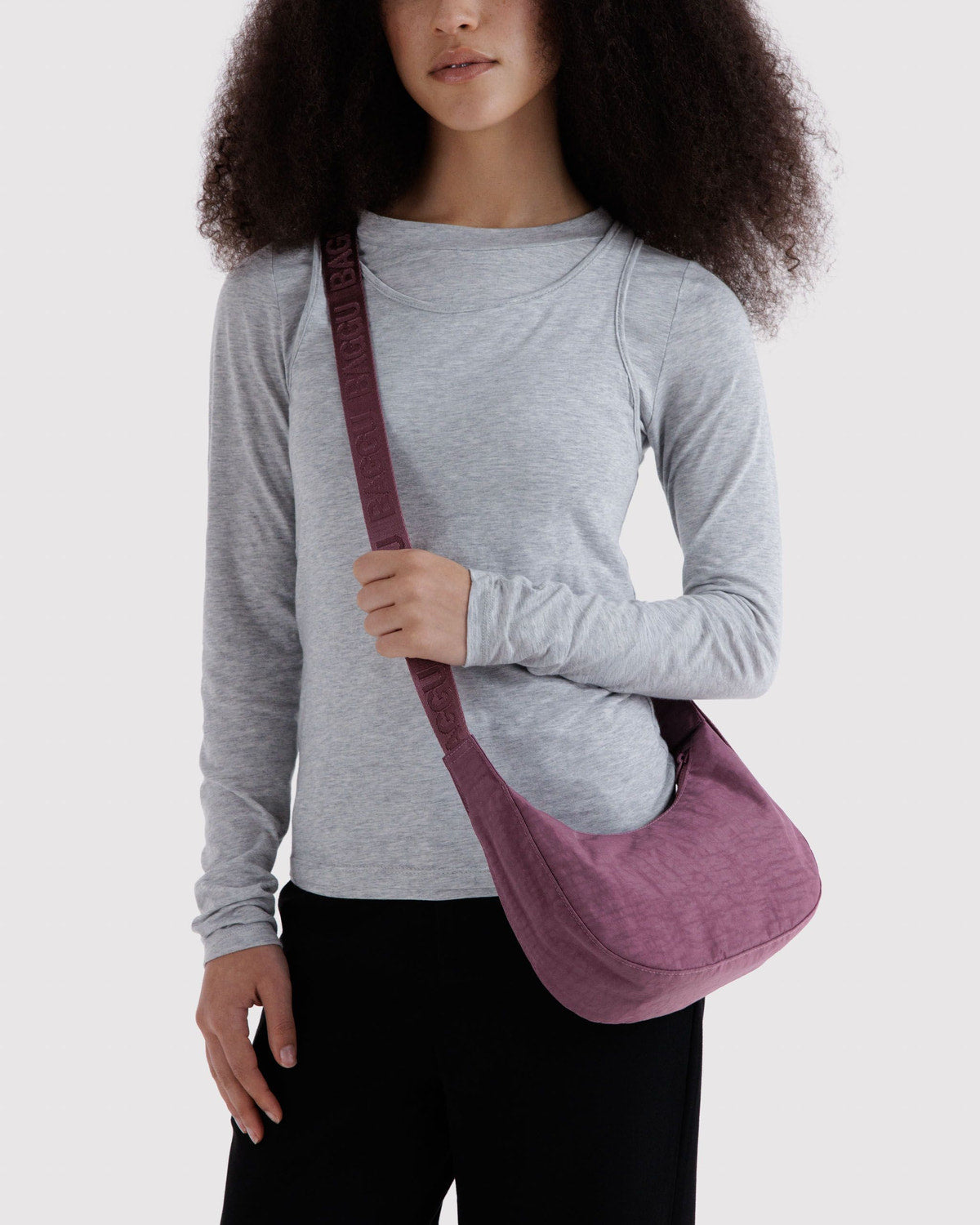 Small nylon crescent bag in dusty purple with adjustable webbing strap
