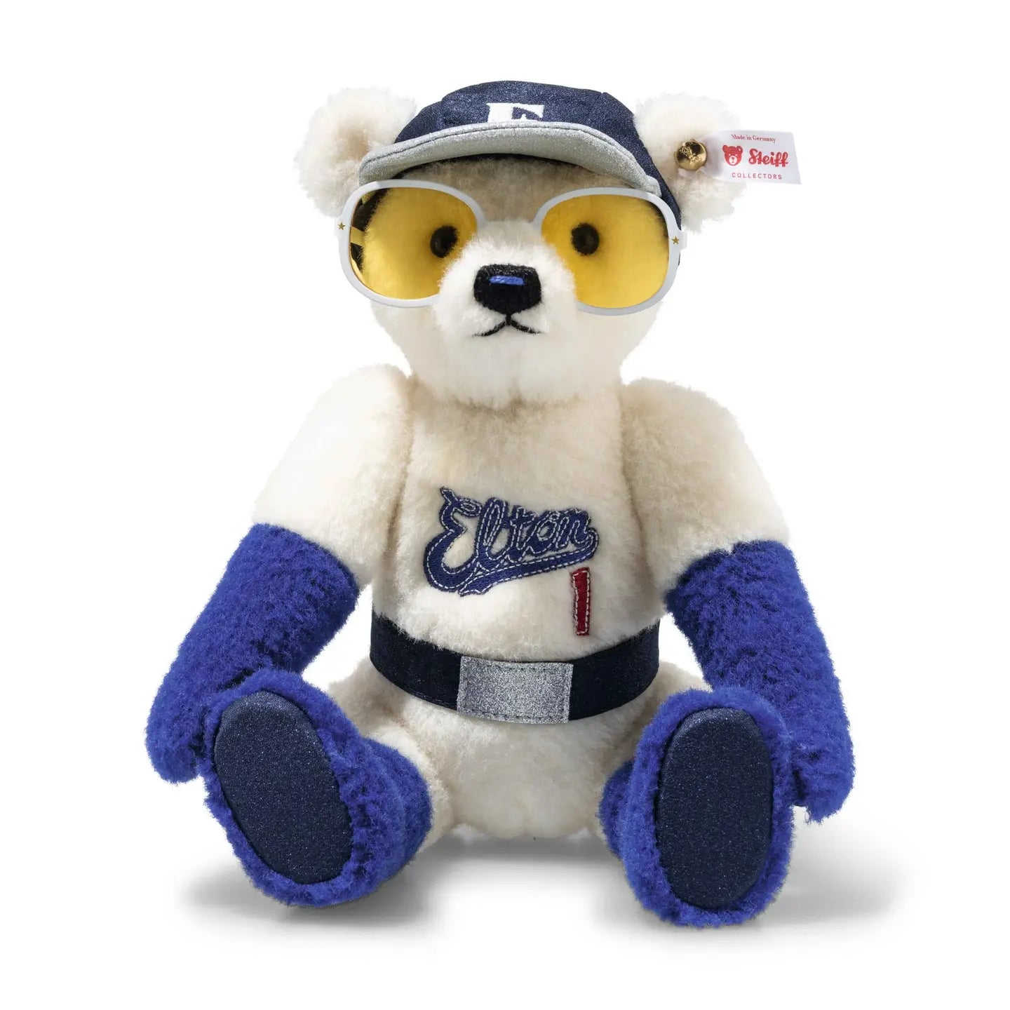 Limited edition teddy bear in cream plush with blue outfit and yellow-tinted glasses