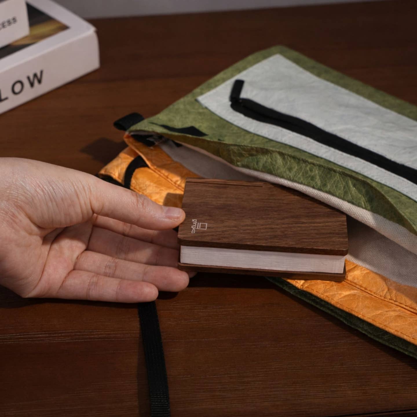 Smart book light held in hand, light wood base with folded lamp head