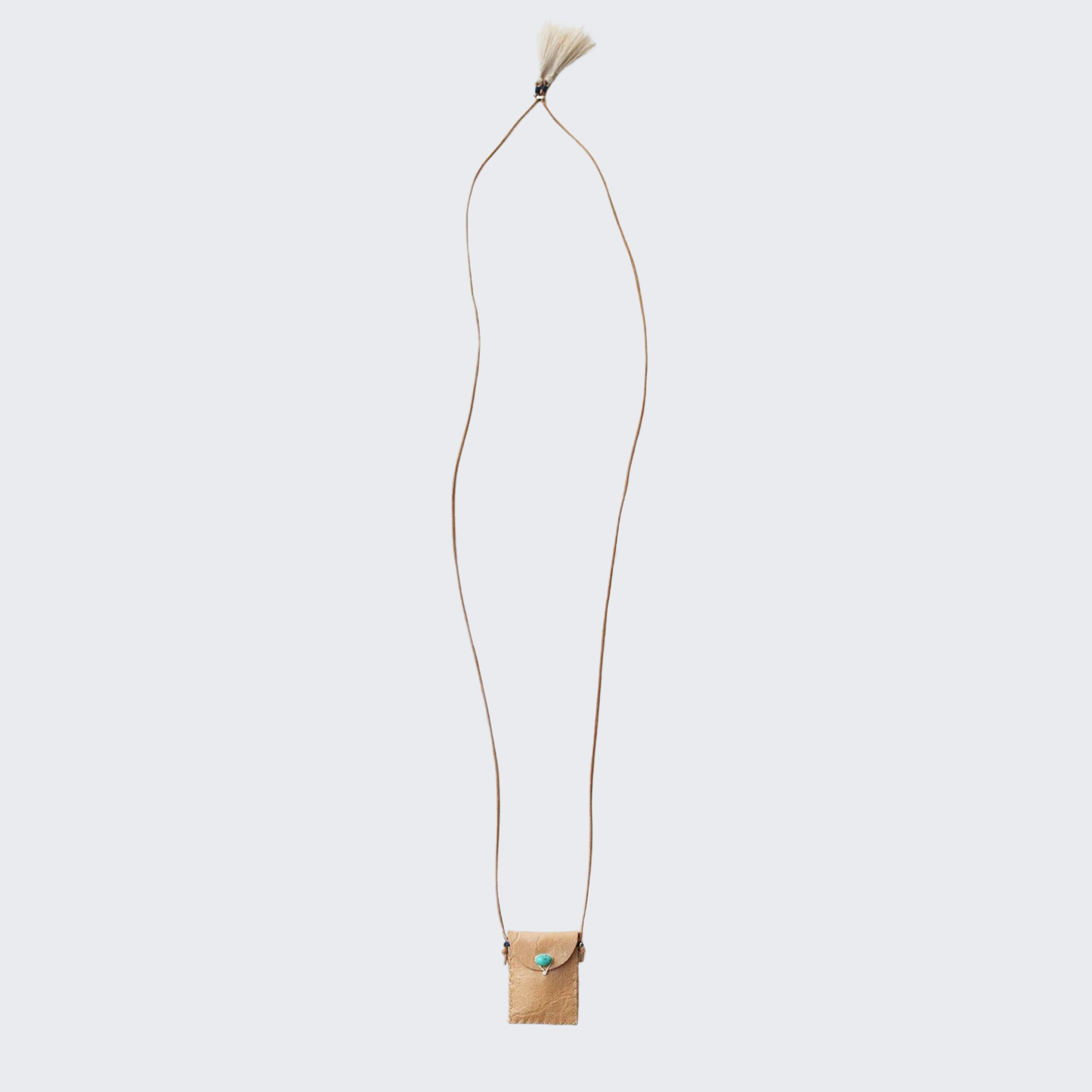 Tan leather amulet pouch on long cord with small tassel detail