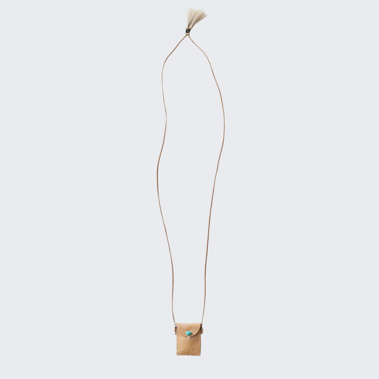 Tan leather amulet pouch on long cord with small tassel detail