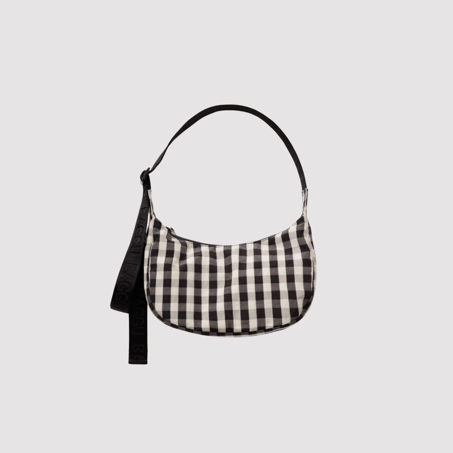 Small nylon crescent bag in black and white gingham with adjustable shoulder strap