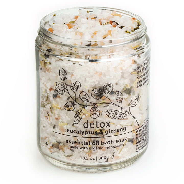 Jar of detox essential oil bath soak with eucalyptus & ginseng label, black lid