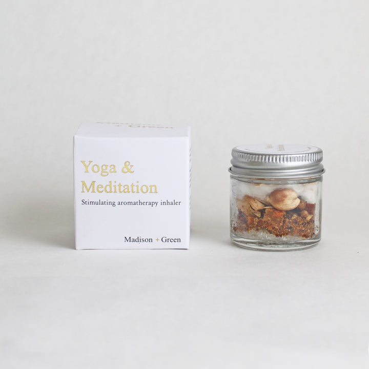 Aromatherapy inhaler jar with Yoga & Meditation scent, next to matching product box