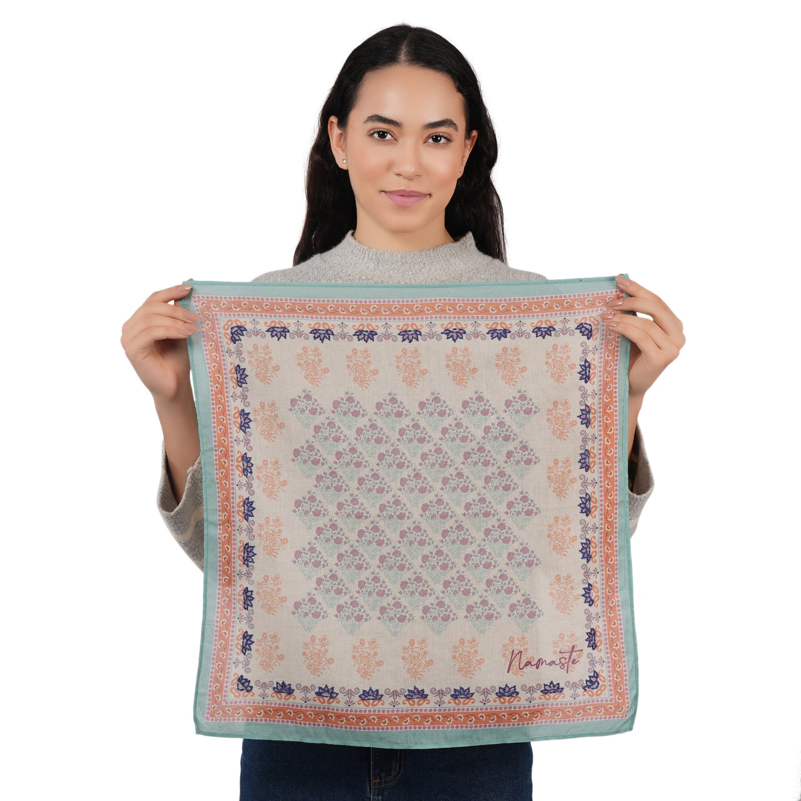 Beige floral embroidered scarf, square design, blue border with orange trim.