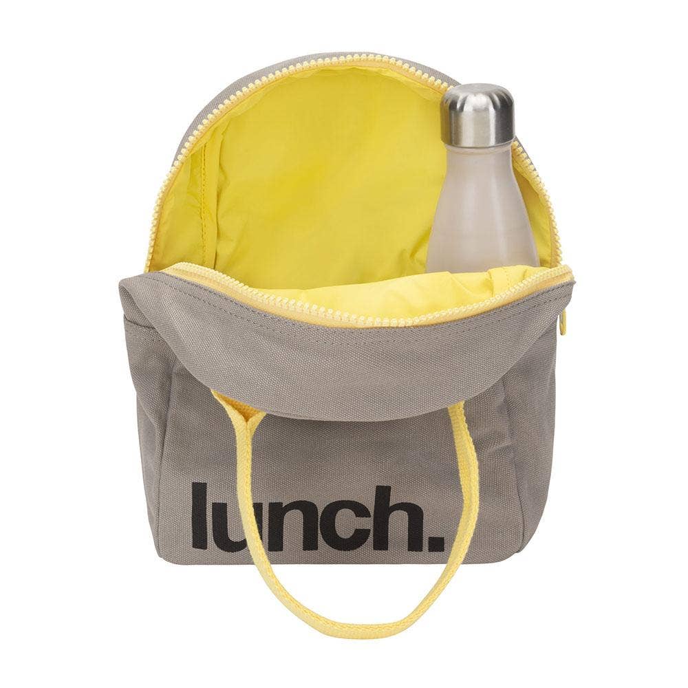 Zipper lunch bag with yellow lining, gray exterior, front “lunch.” print, and carry handle