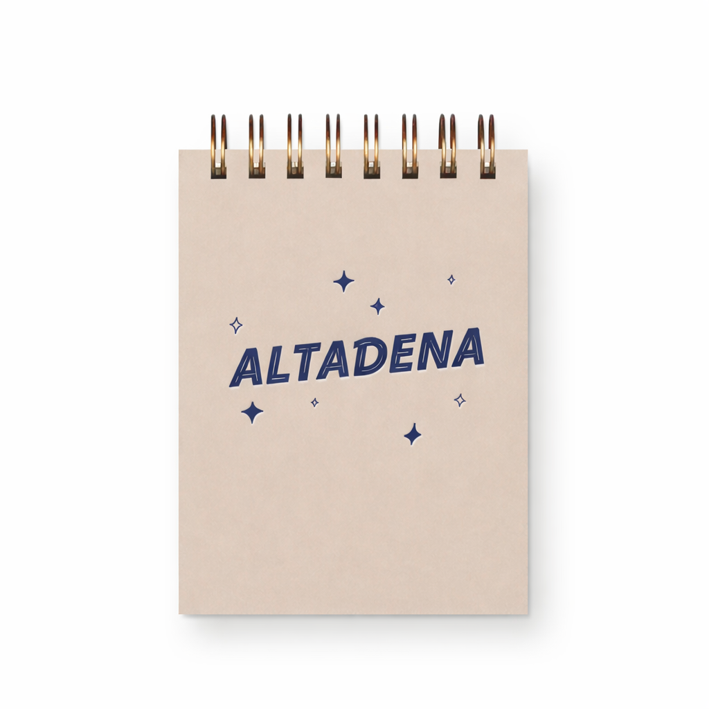 Mini jotter notebook with beige cover, blue ALTADENA text, star pattern and metal clip binding