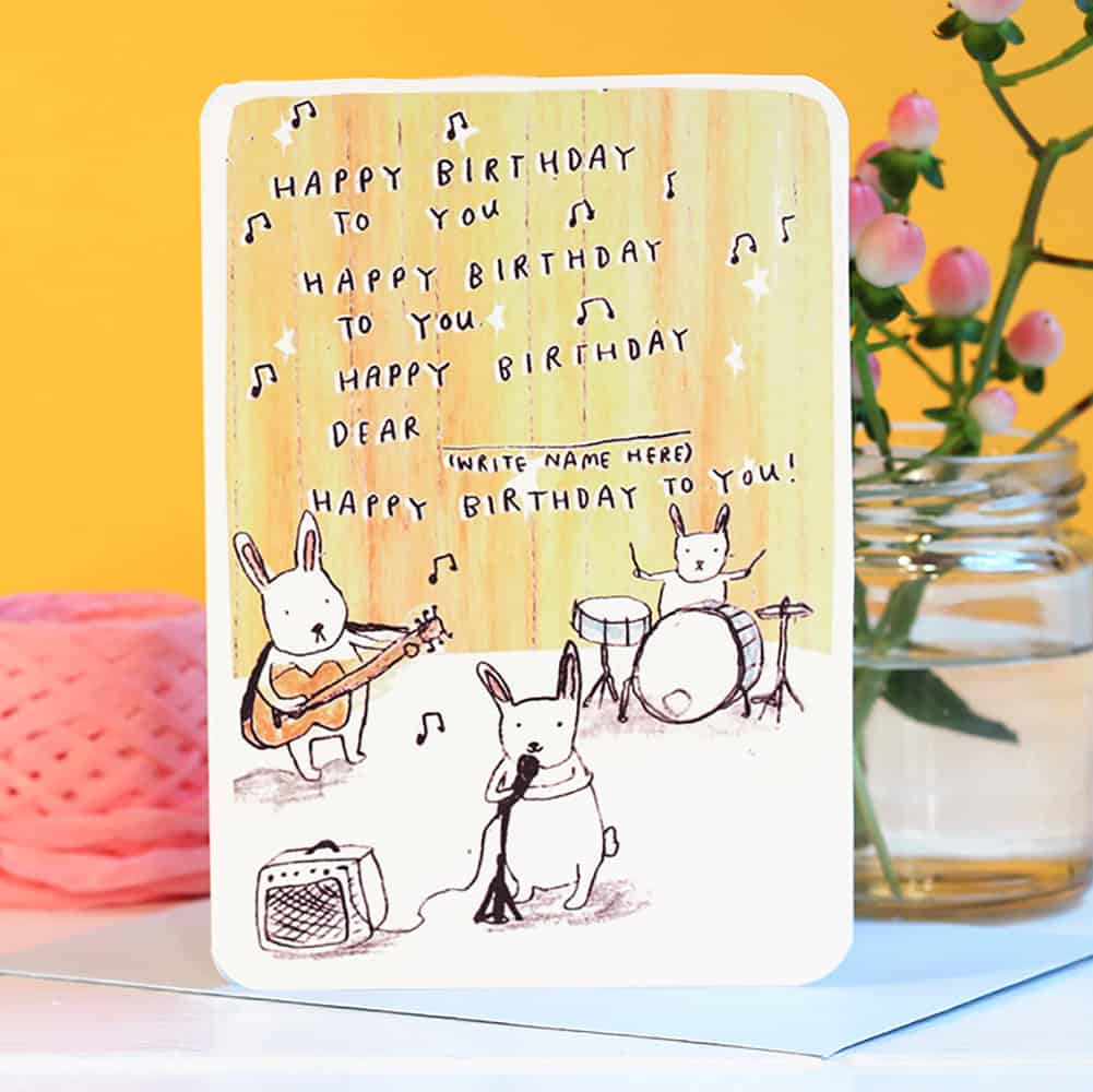 Birthday bunny band greeting card with bunnies playing instruments and 'Happy Birthday' text