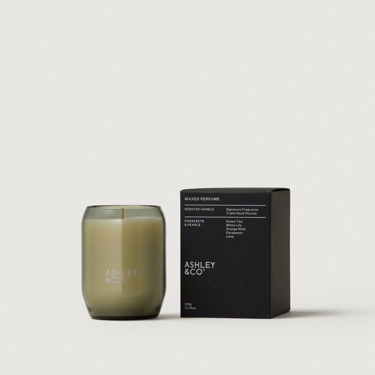 Waxed perfume candle in smoky olive glass jar with black scent box