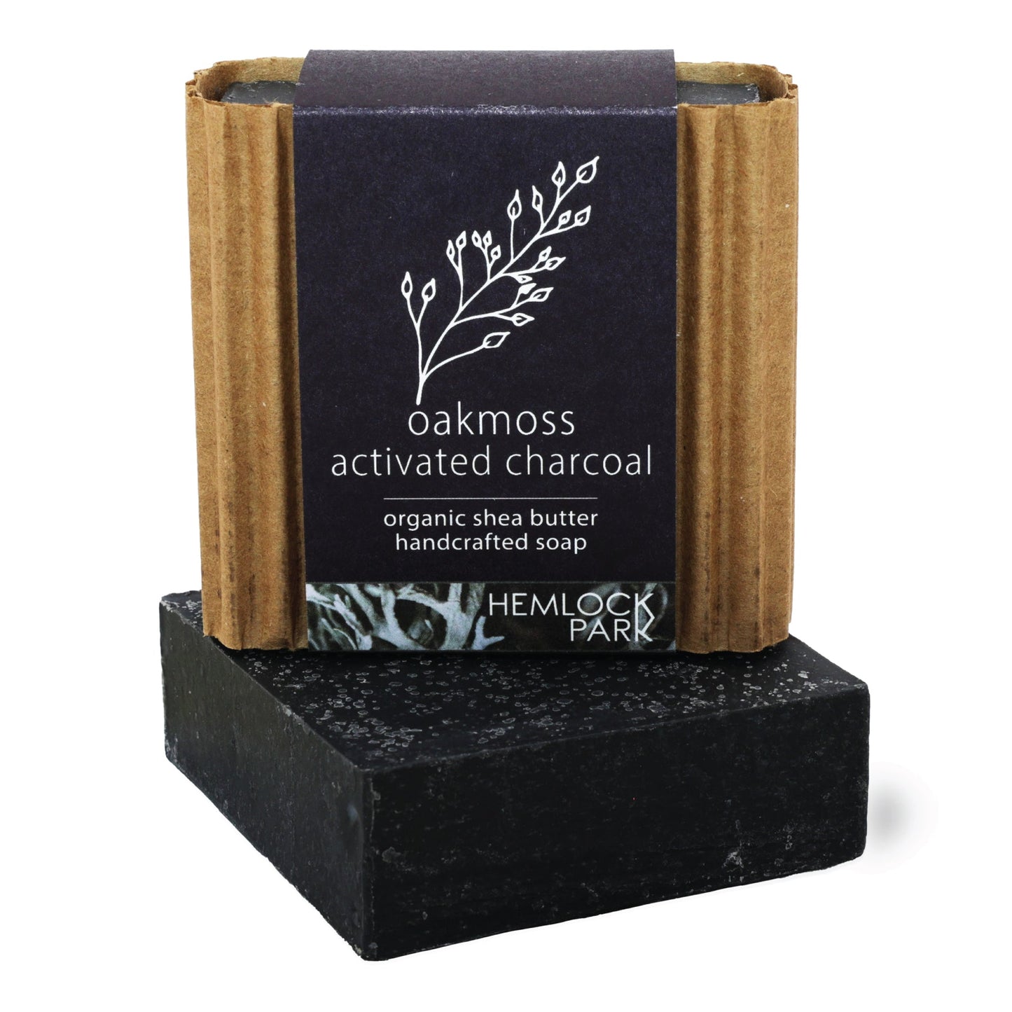 Oakmoss activated charcoal organic shea butter soap bar, dark black color with label wrap