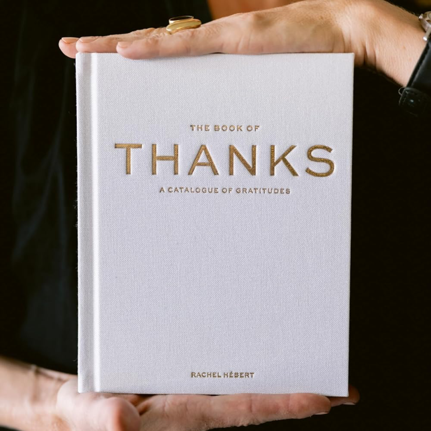 Hardcover gratitude book with white cover and gold “THANKS” title