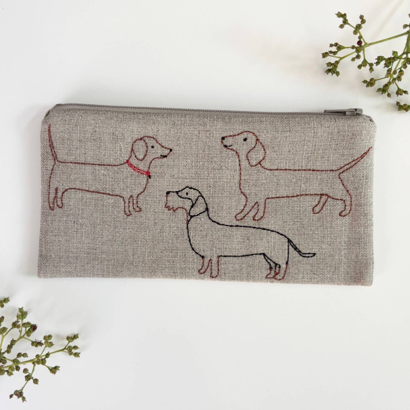 Small heather gray linen pouch with zipper and red embroidered dogs