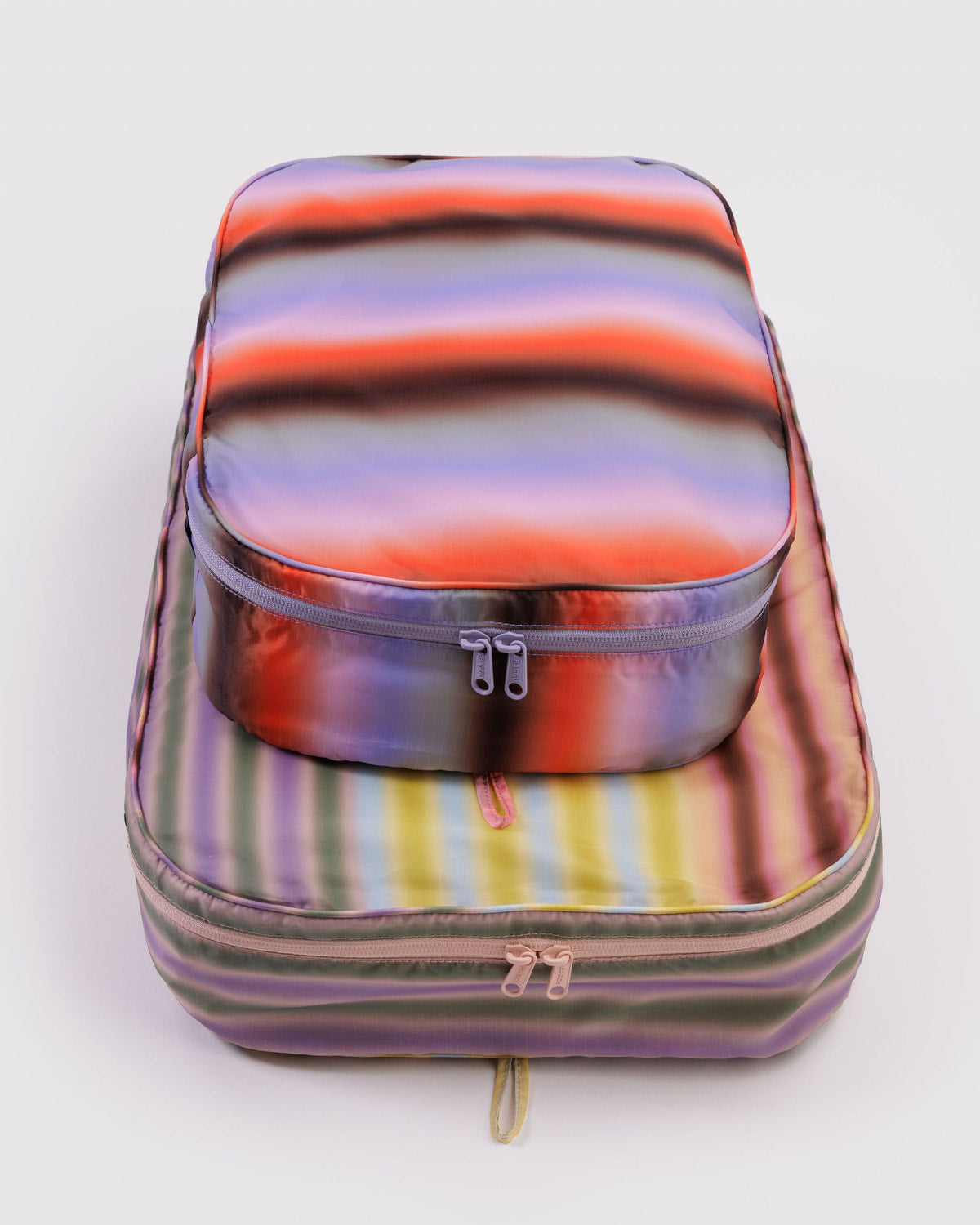 Gradient stripe packing cube with rounded top handle and two-way zipper closure