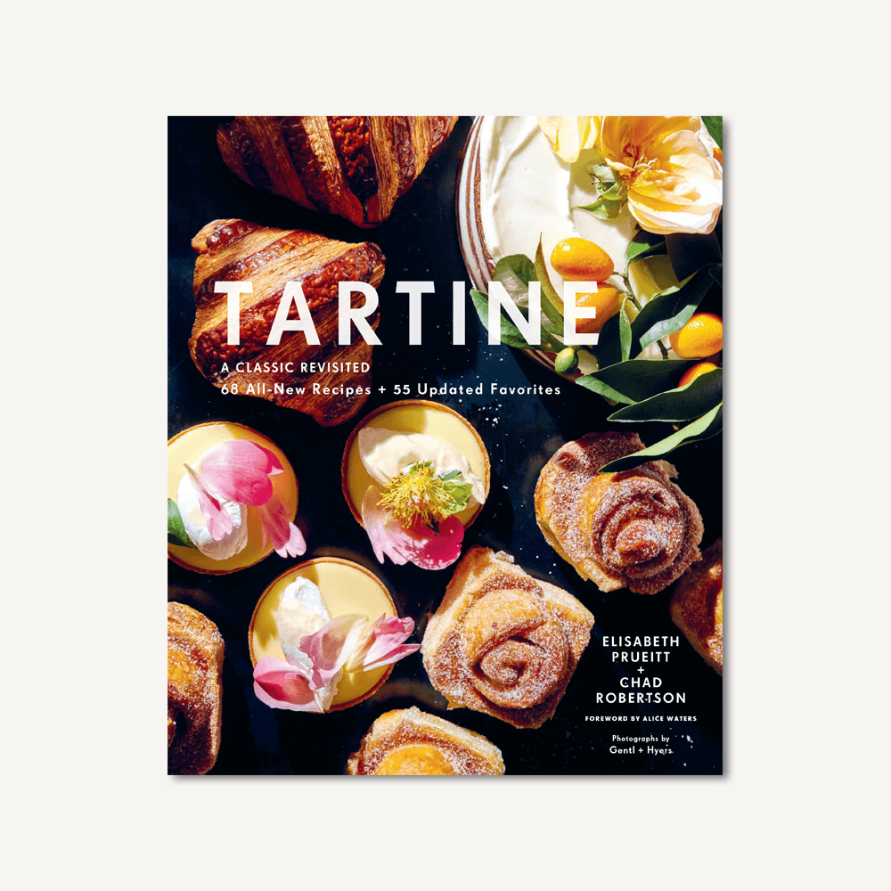 Cookbook cover with pastries, citrus, and floral graphics