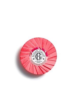 Round pink soap bar with ridged pattern and Roger & Gallet logo on center