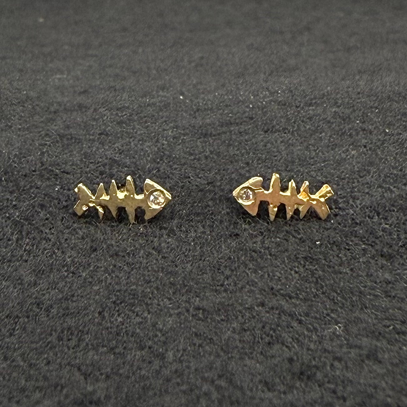 Fishbone post earrings in 14k gold with clear stone row, two-piece pair