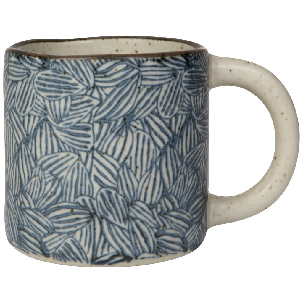 Blue leaf-pattern ceramic mug with round handle and speckled rim