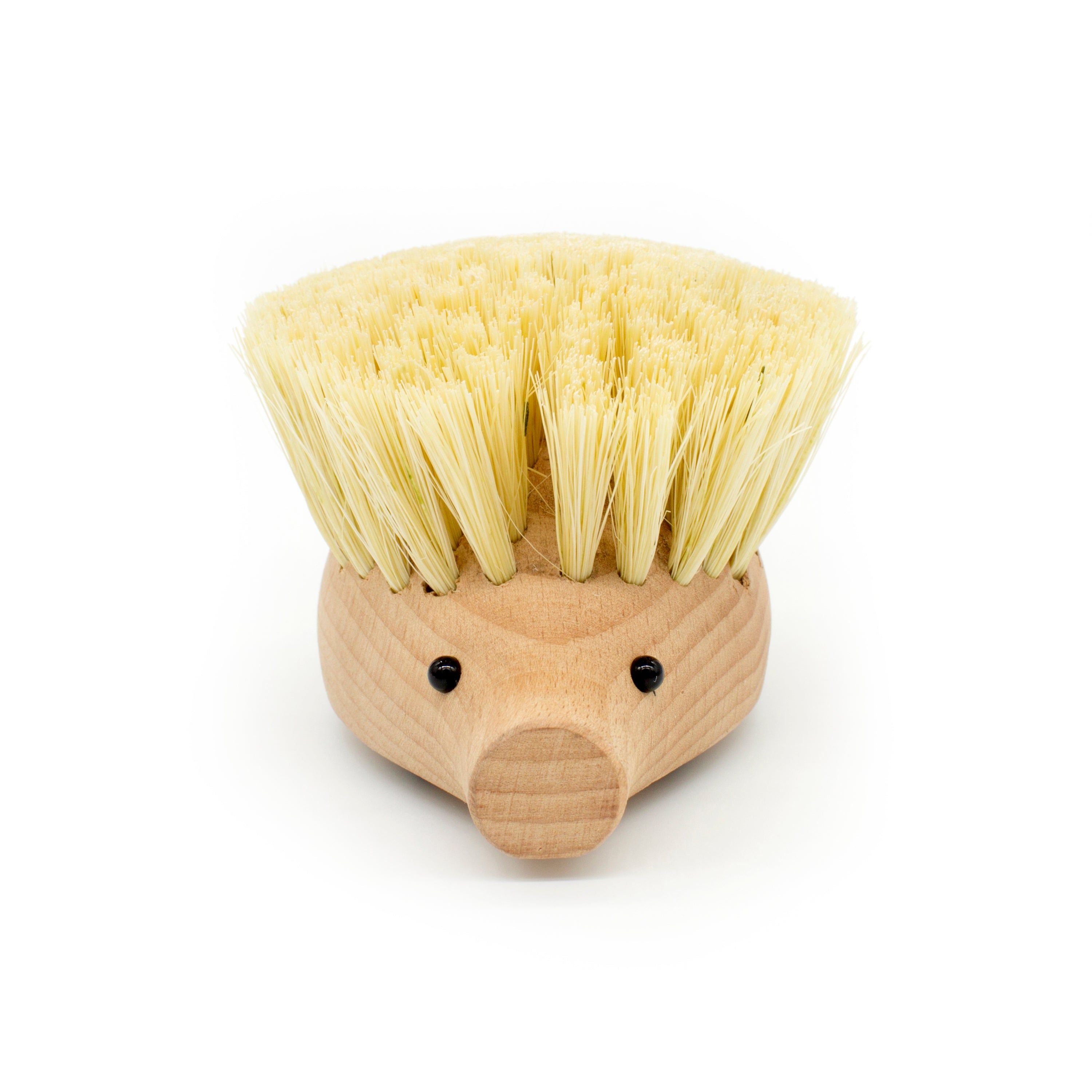 Hedgehog-shaped dish scrubber with light wood body and beige bristle head