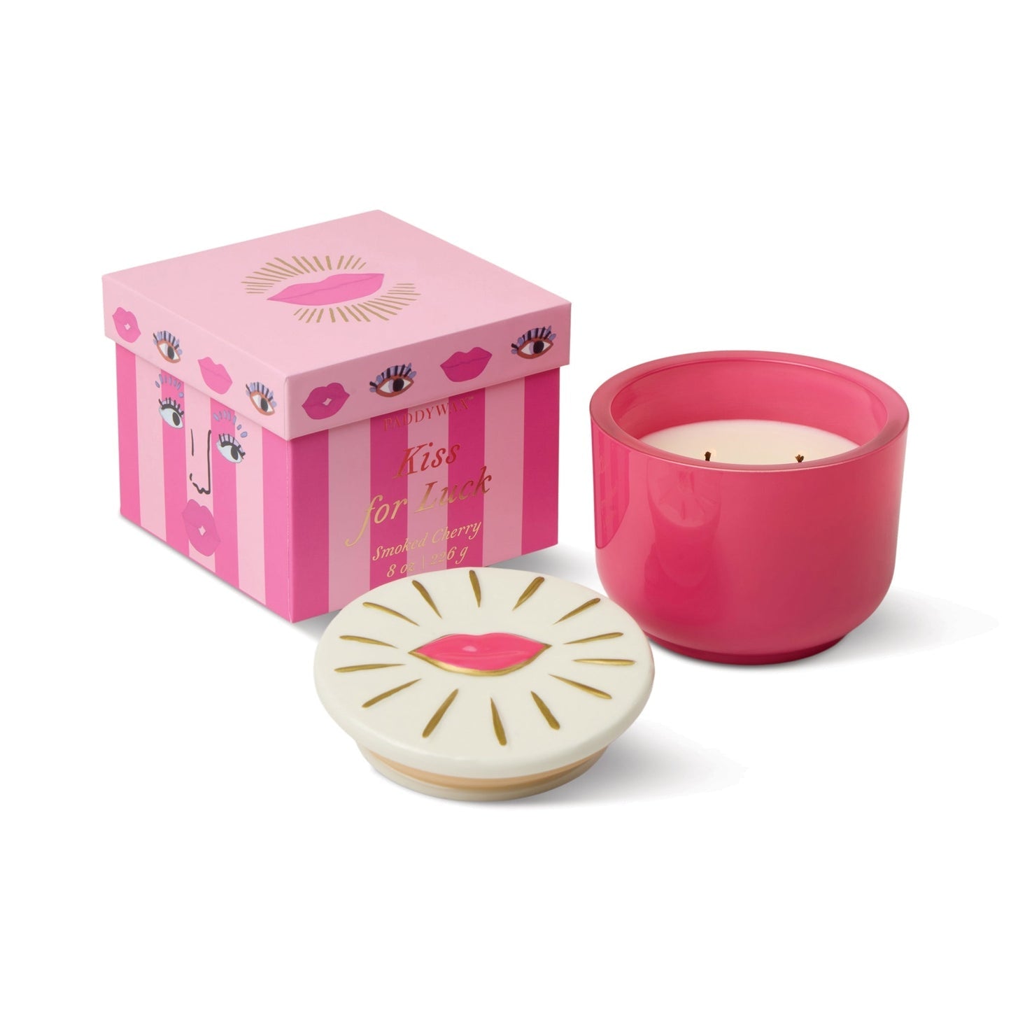 8oz scented candle in pink-red jar with lips-shaped lid, cherry graphic on lid