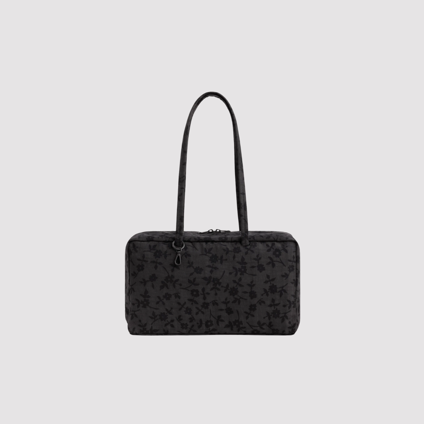 Medium nylon bowler bag in black with dark floral pattern and top zipper with handles.