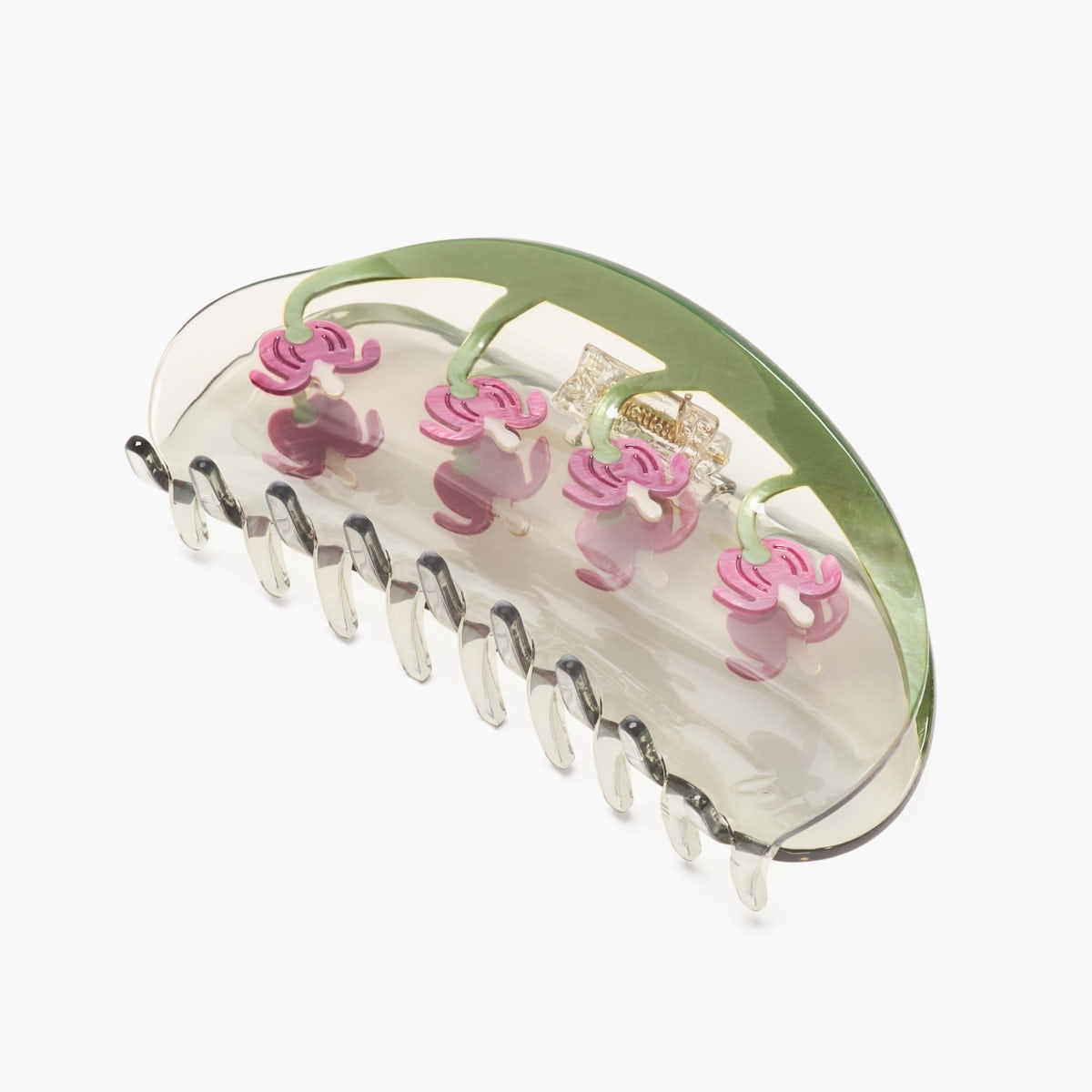 Clear green long hair claw clip with pink flower accents and metal teeth