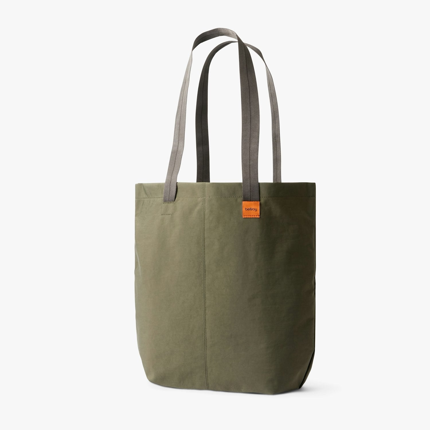 City tote bag in muted green with two long handles and a small front brand label.