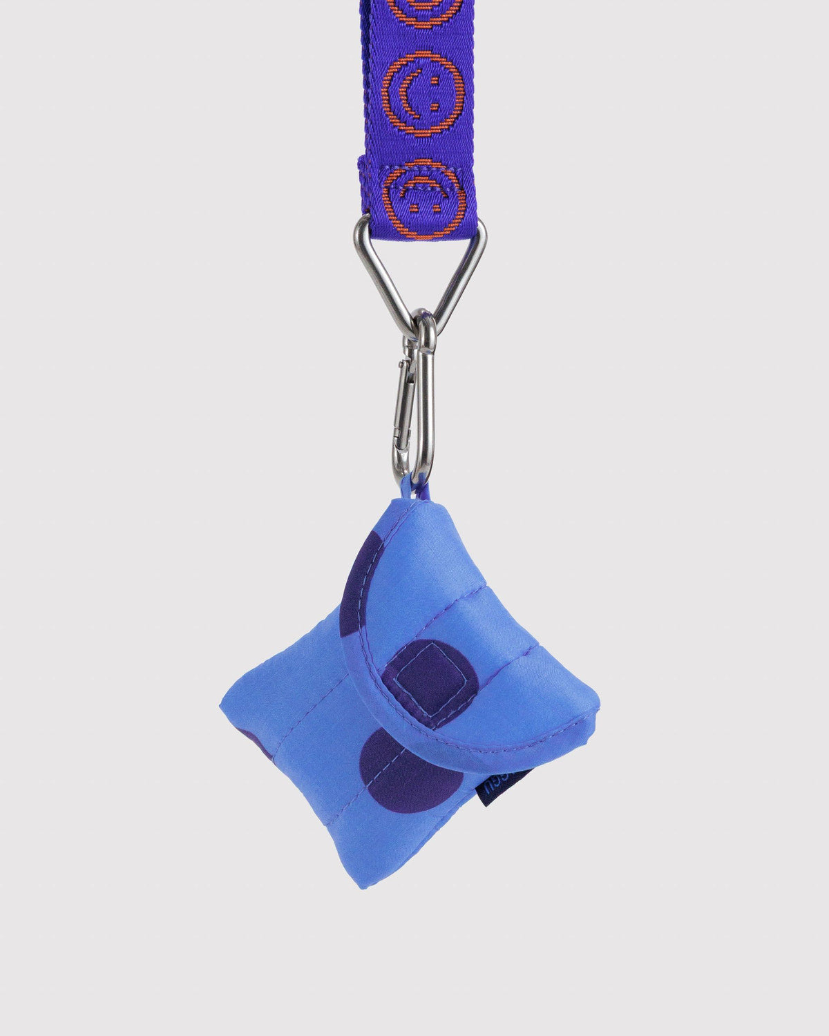 Blue puffy earbuds case keychain with patterned strap, metal clip, dark purple patch detail