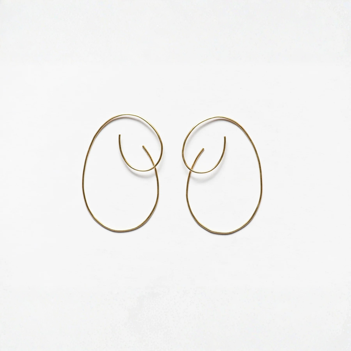 Pair of large oval hoop threader earrings, gold-tone with curved ends