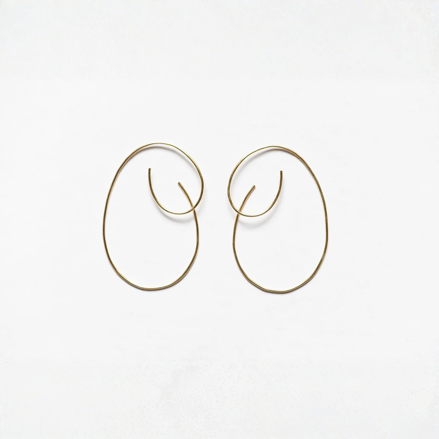 Pair of large oval hoop threader earrings, gold-tone with curved ends