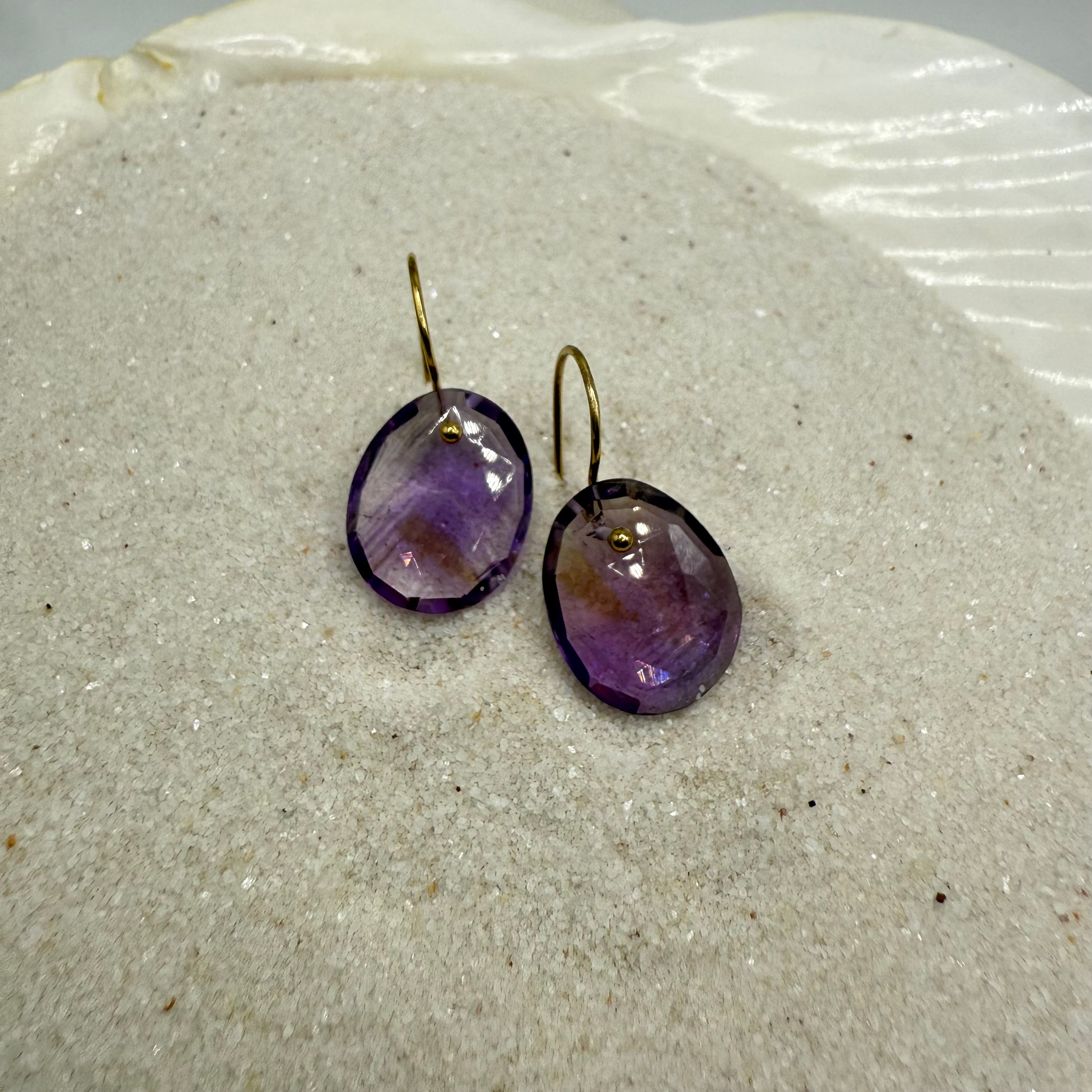 Amethyst purple oval faceted gold-filled drop earrings, gold hooks visible