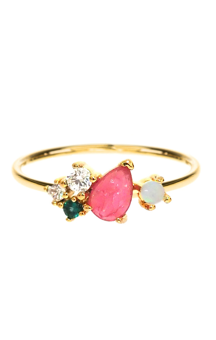Gold-tone cluster ring with pink teardrop center stone and small clear, green accents