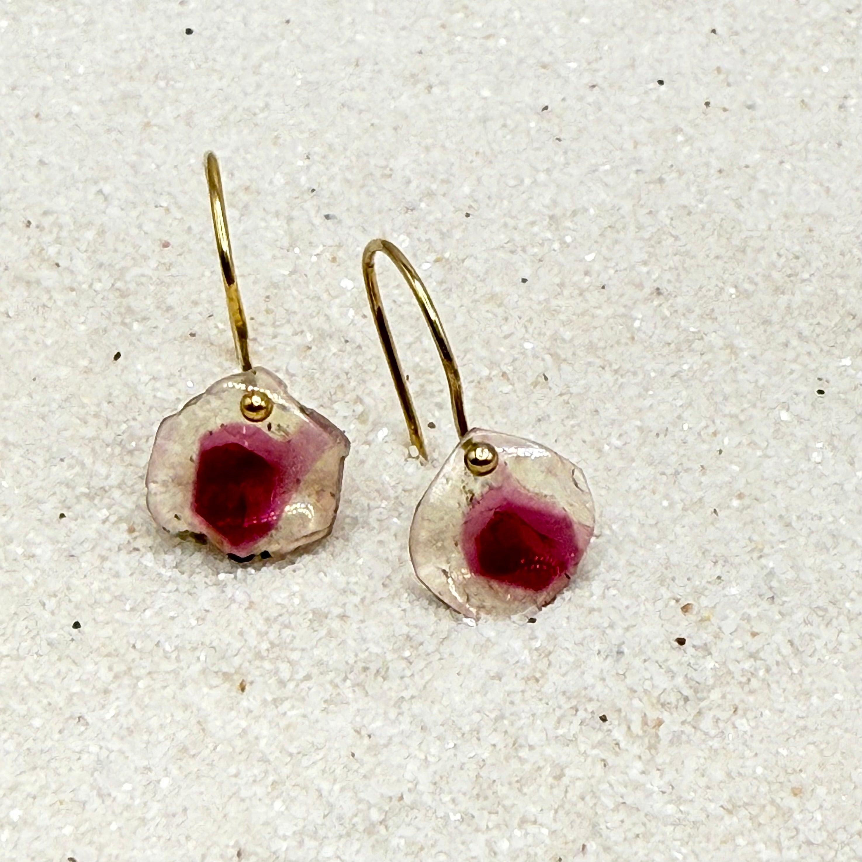 Gold dangle earrings with faceted pink stone drops and gold hook backs