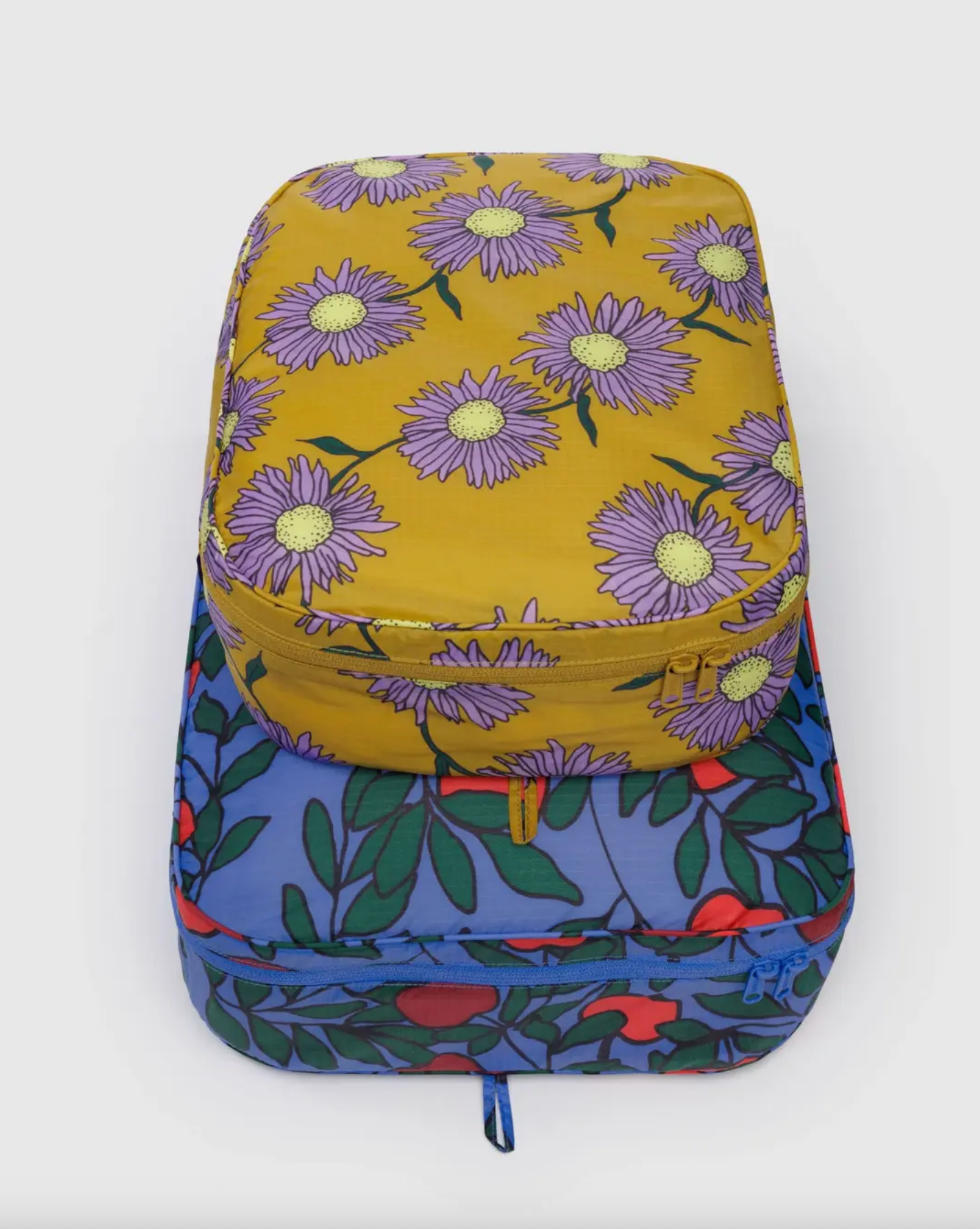 Large packing cube set with yellow daisy print and teal floral bottom, zipped
