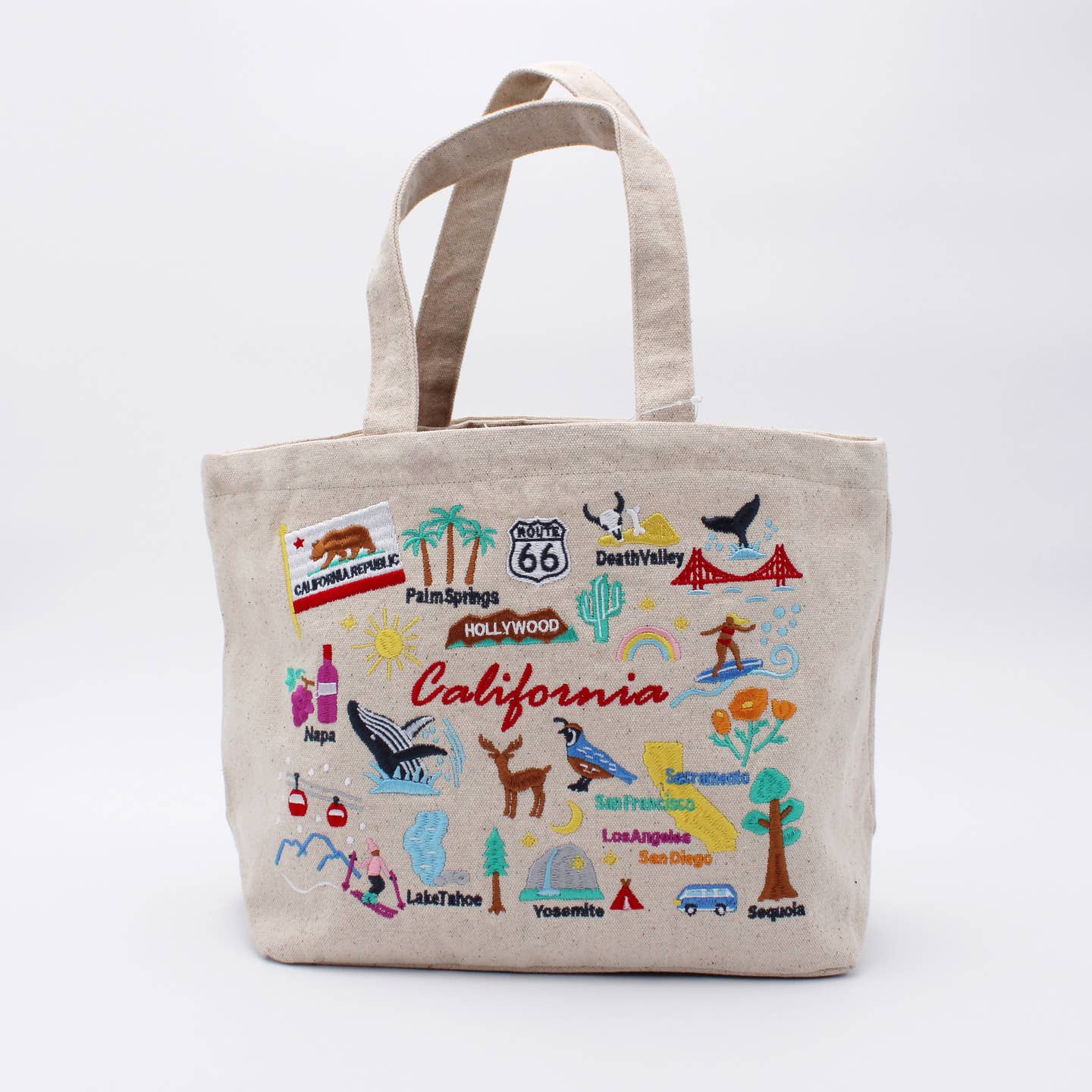 Embroidered California lunch bag, beige canvas with front view of embroidered travel icons