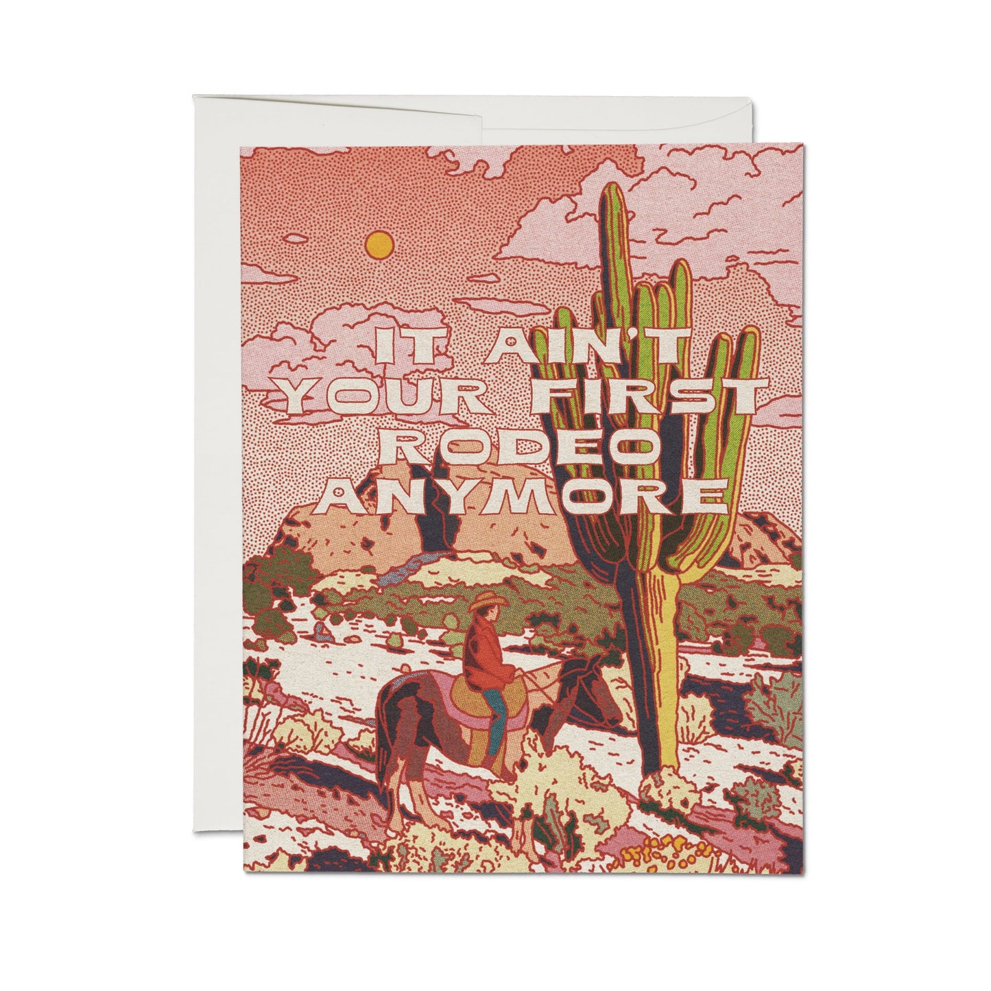 Greeting card with red desert scene and cactus, text: “Ain’t it your first rodeo anymore?”