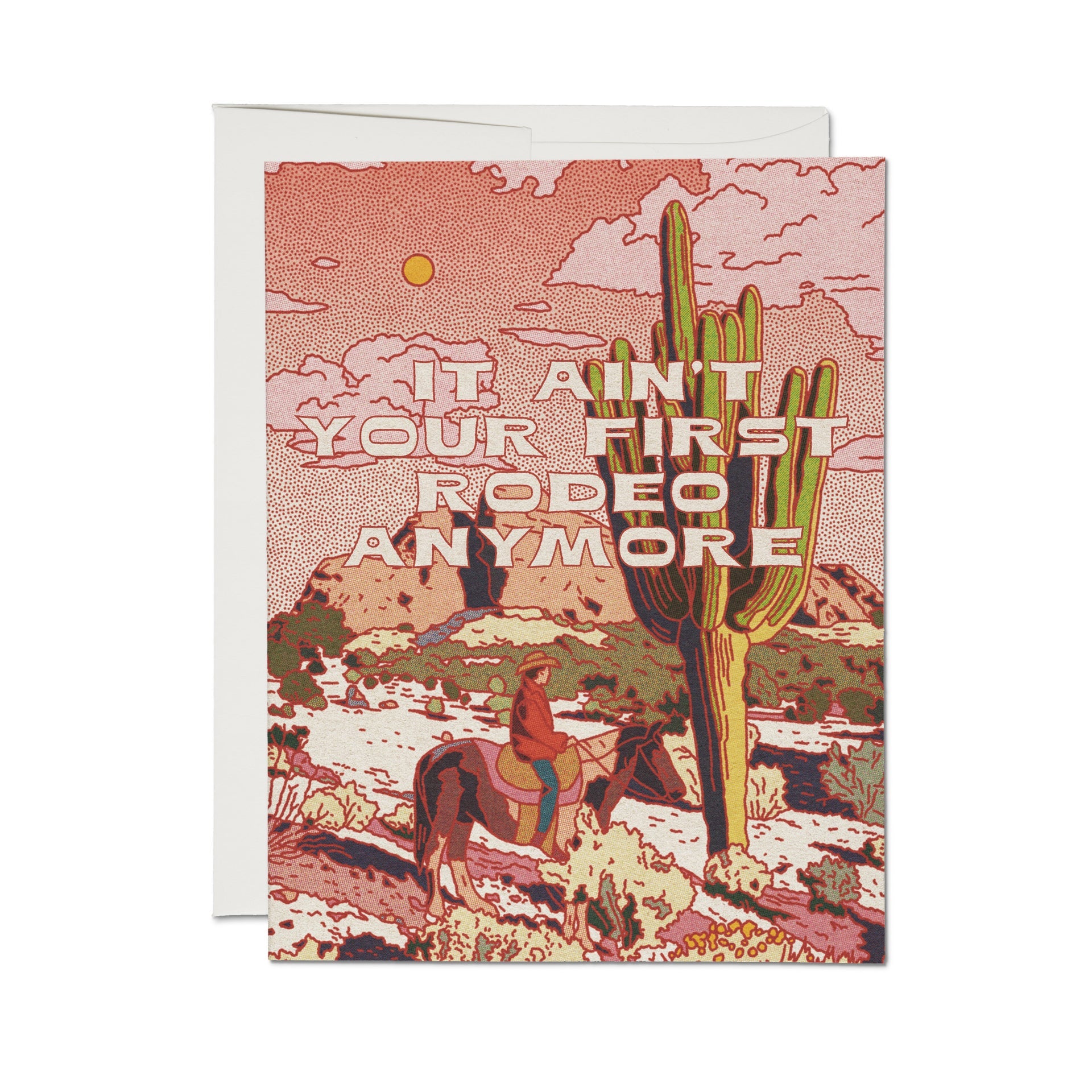 Greeting card with red desert scene and cactus, text: “Ain’t it your first rodeo anymore?”